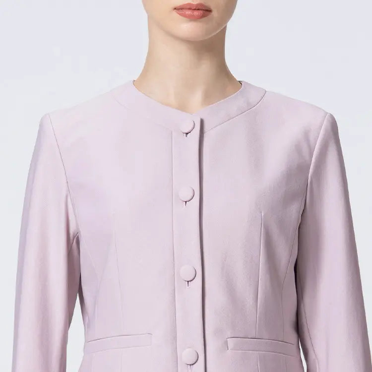 A sleek collarless design that elegantly frames the neckline while creating a flattering face-slimming effect